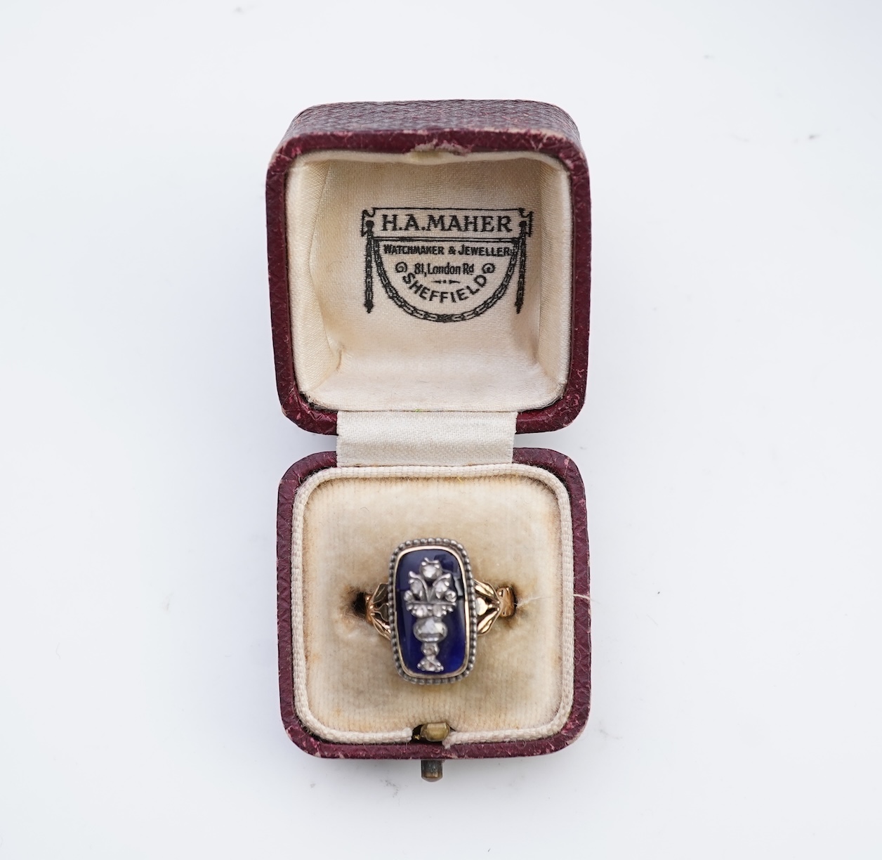 A diamond and blue glass ring
